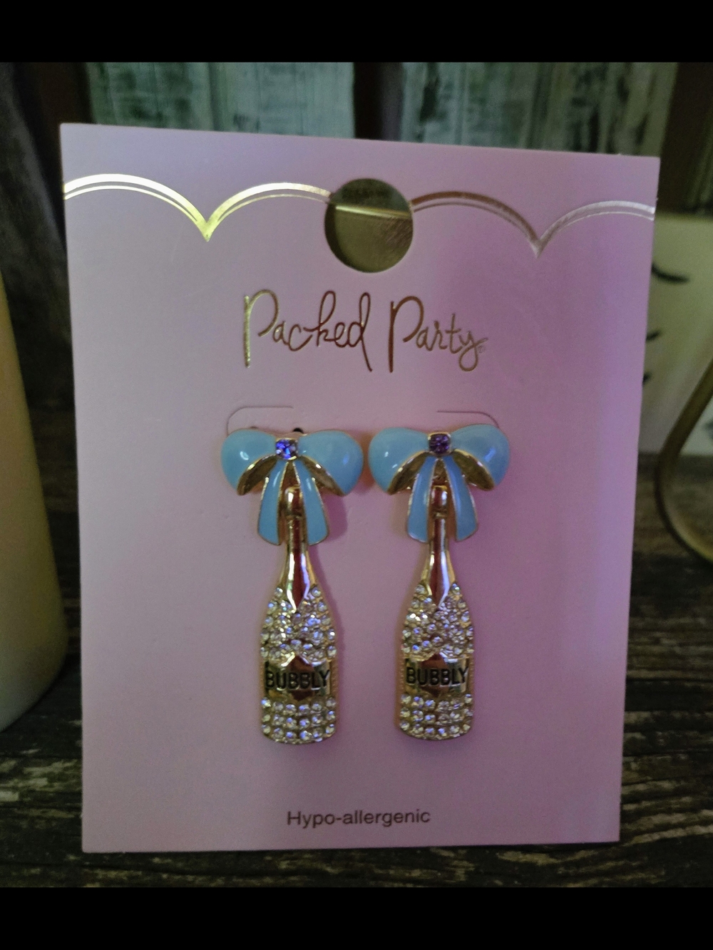 Packed Party Gold Champagne Bottle Earrings with Light Blue Bows